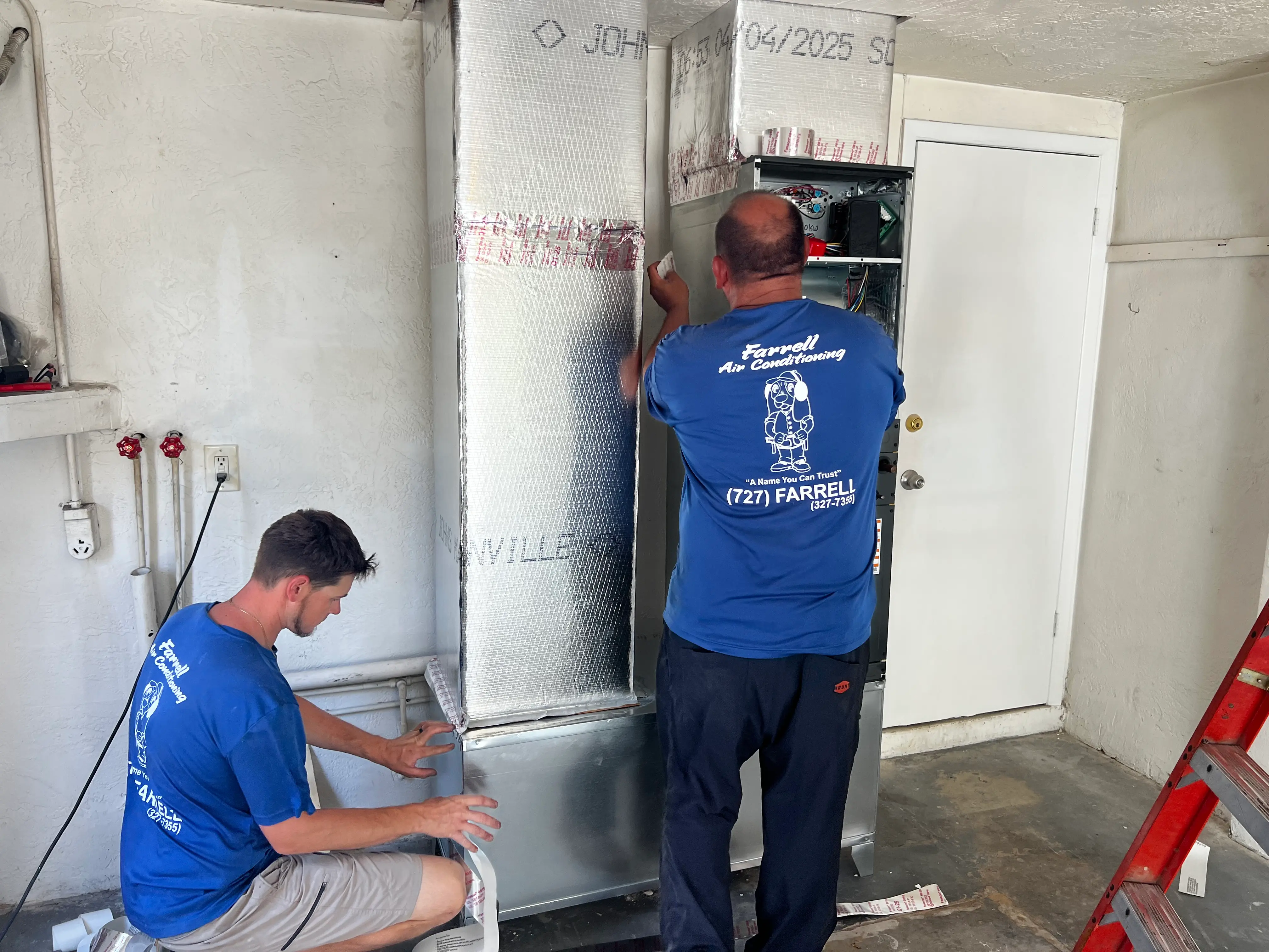 Farrell Air Conditioning team installing a new AC system in Spring Hill, FL