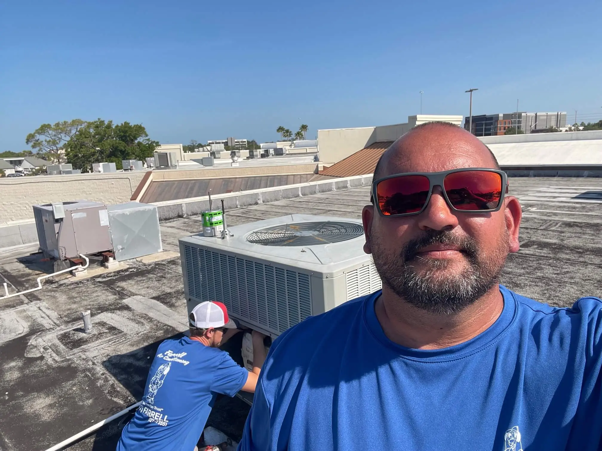 Farrell Air Conditioning technician servicing an AC unit in Port Richey, FL