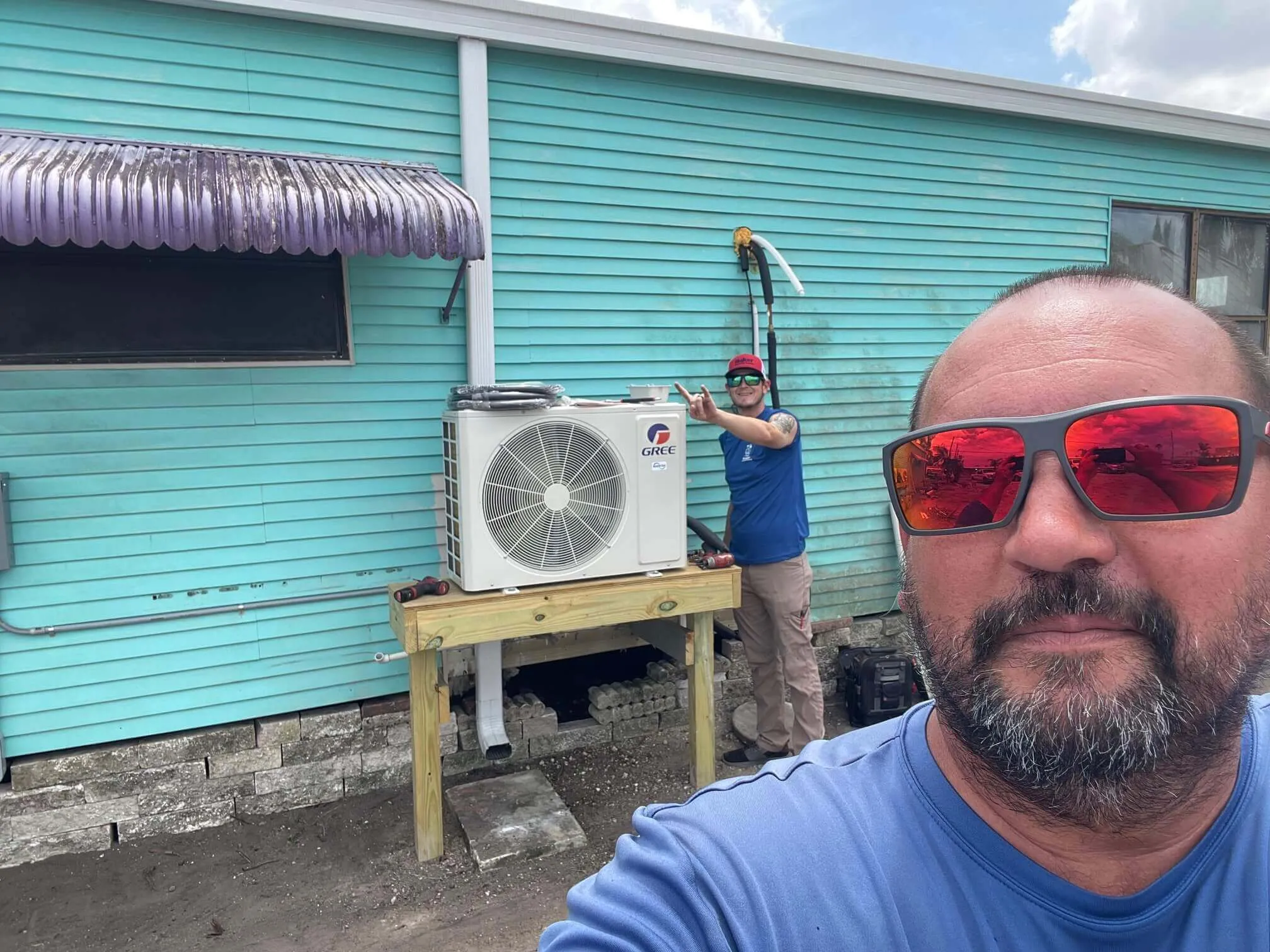 HVAC technician working on AC unit
