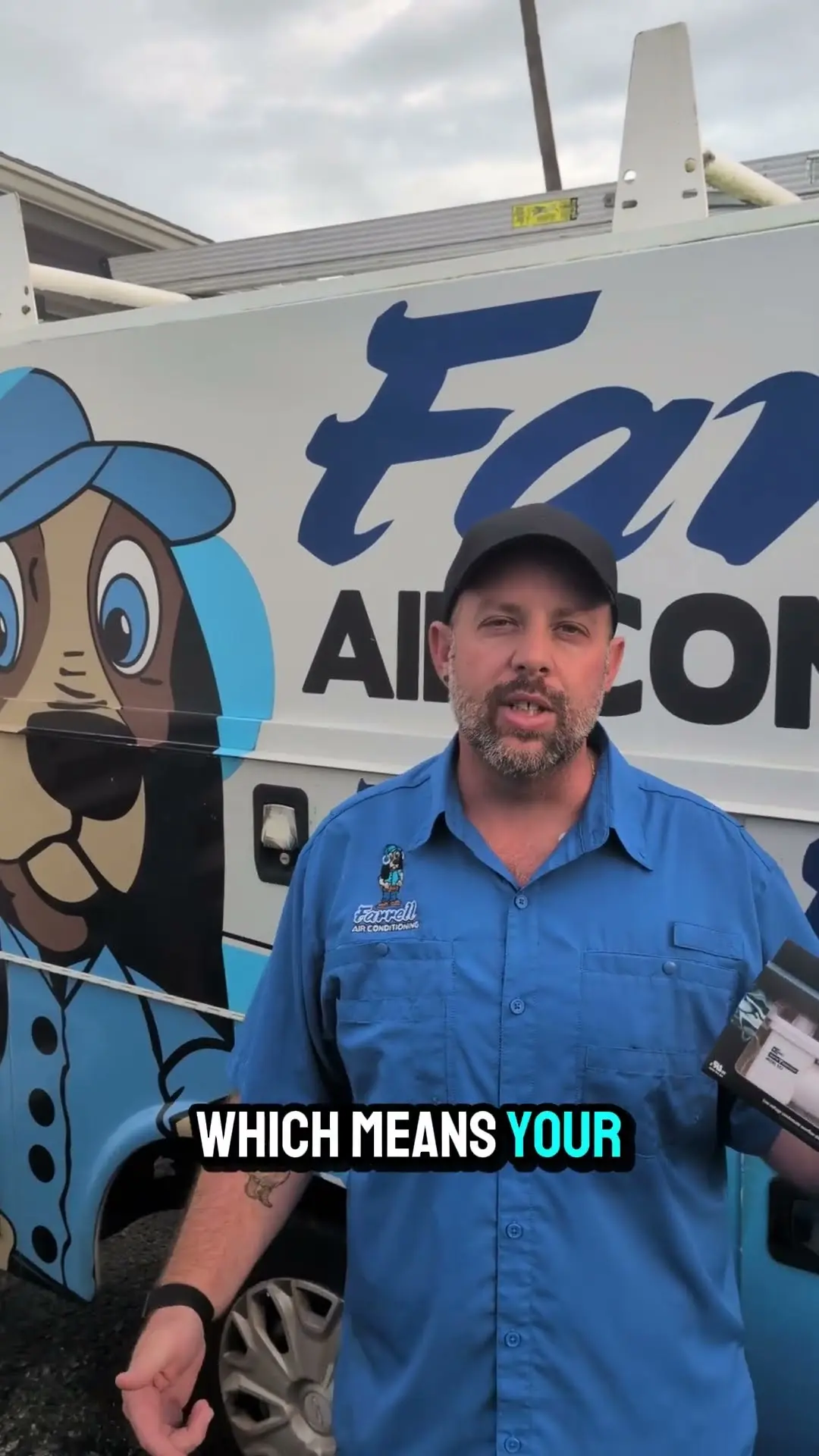 Goose from Farrell Air Conditioning beside a Farrell service van in Port Richey, explaining why a thermostat screen goes blank